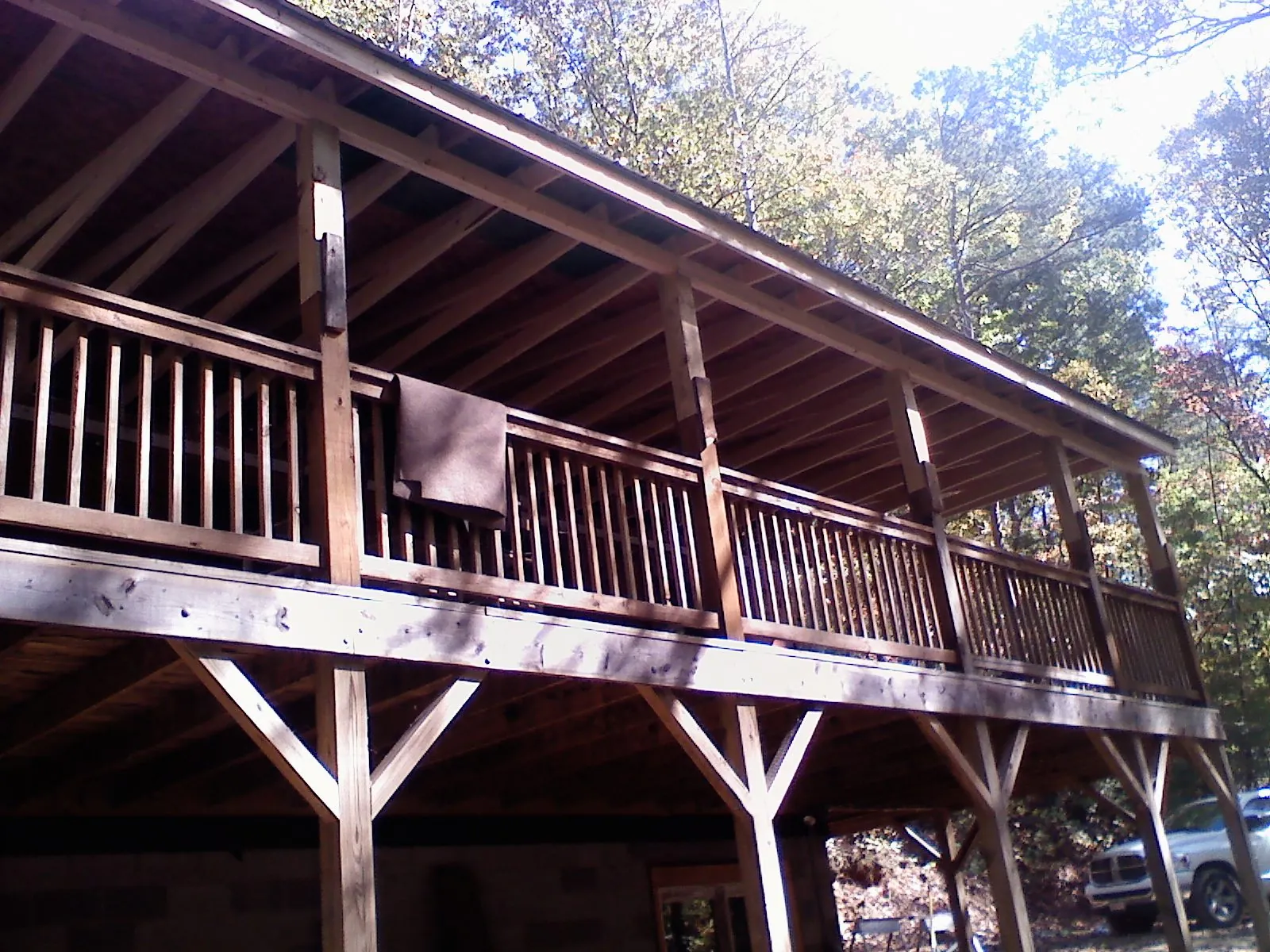 Timber framing under a new elevated porch and deck — Roof Leak Repair in Ithaca by Roofing Brothers